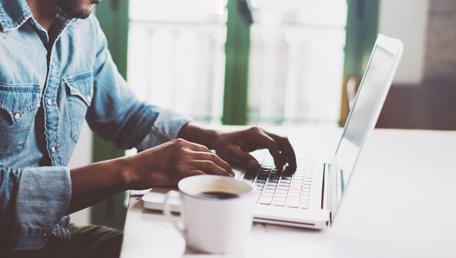 A man working from home on a laptop.