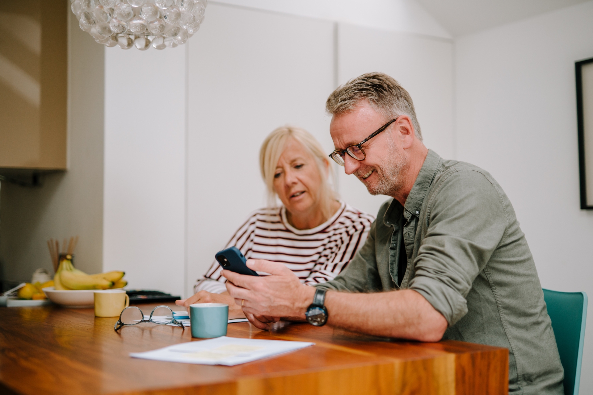 A couple going through paperwork together.