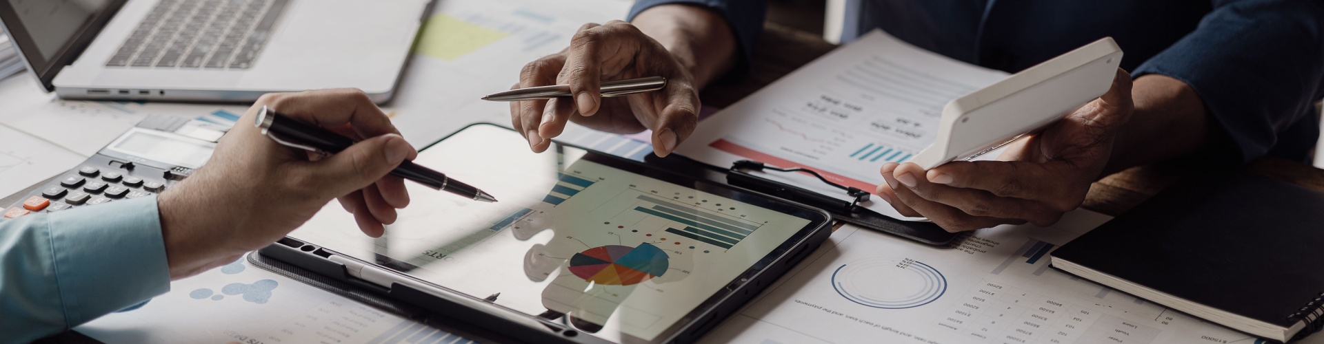 Business people looking at documents in an office.