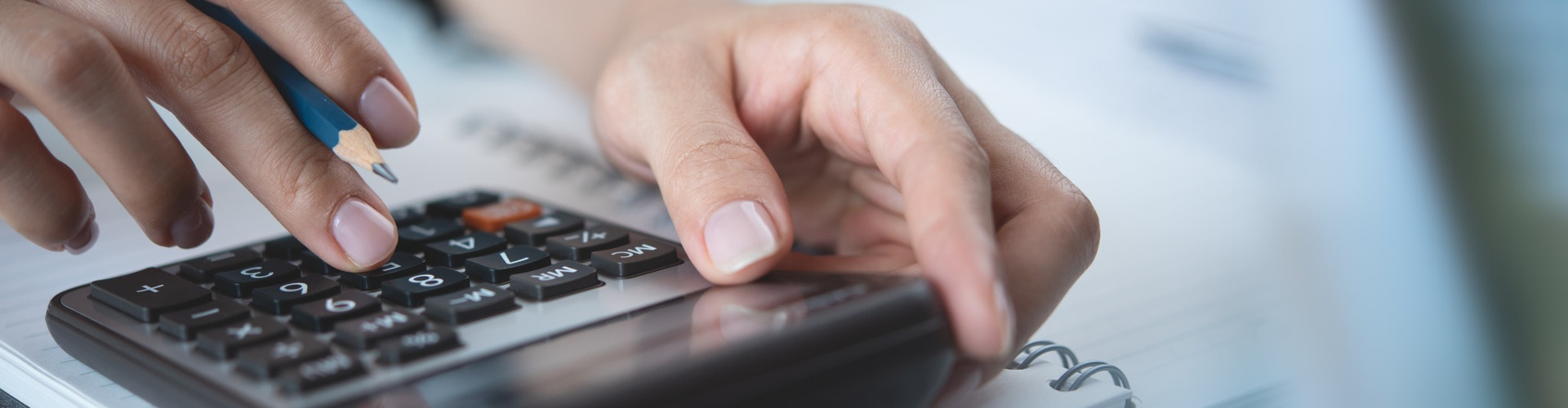 A person using a calculator.