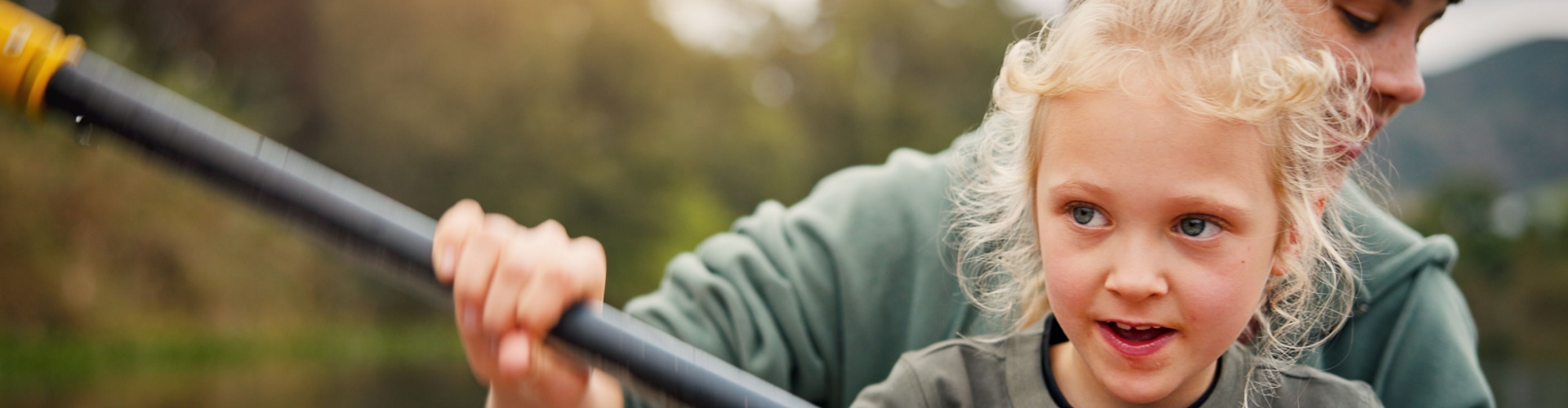 A mum and child kayaking.