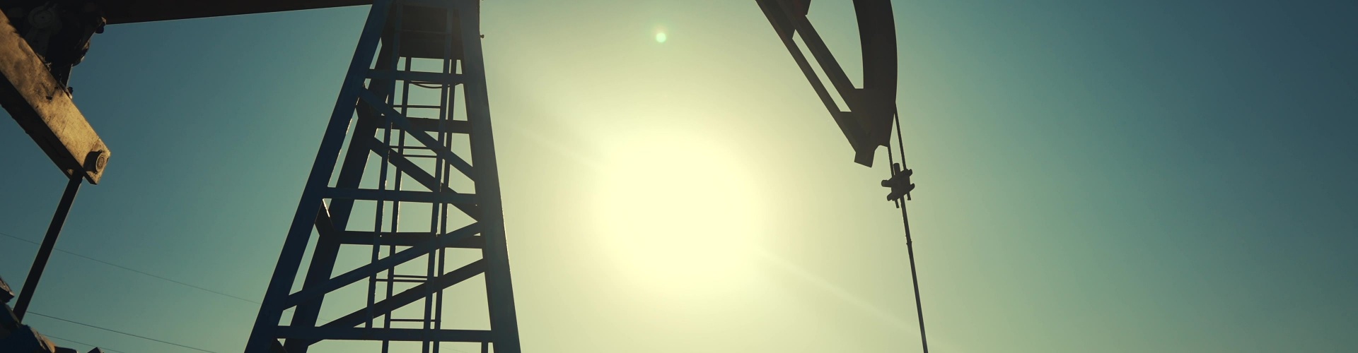 A silhouette of an oil pump.