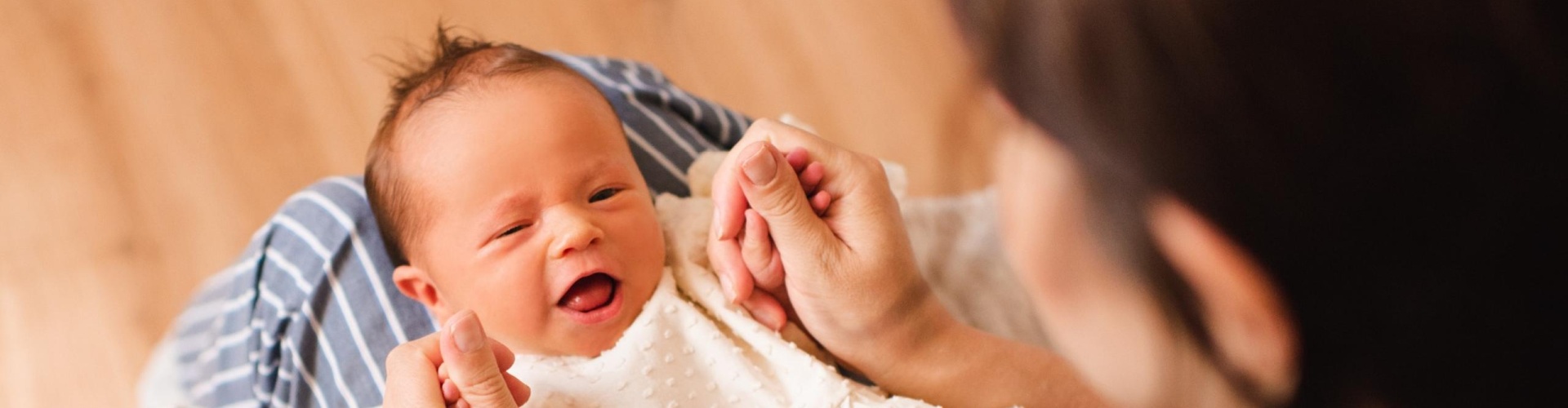 A mother holding a baby.